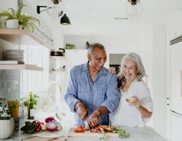 Functional health coaching client makes a healthy dinner