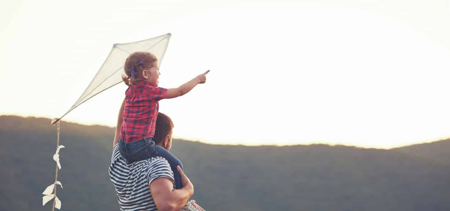 Integrative Cardiology patient holds daughter on shoulders